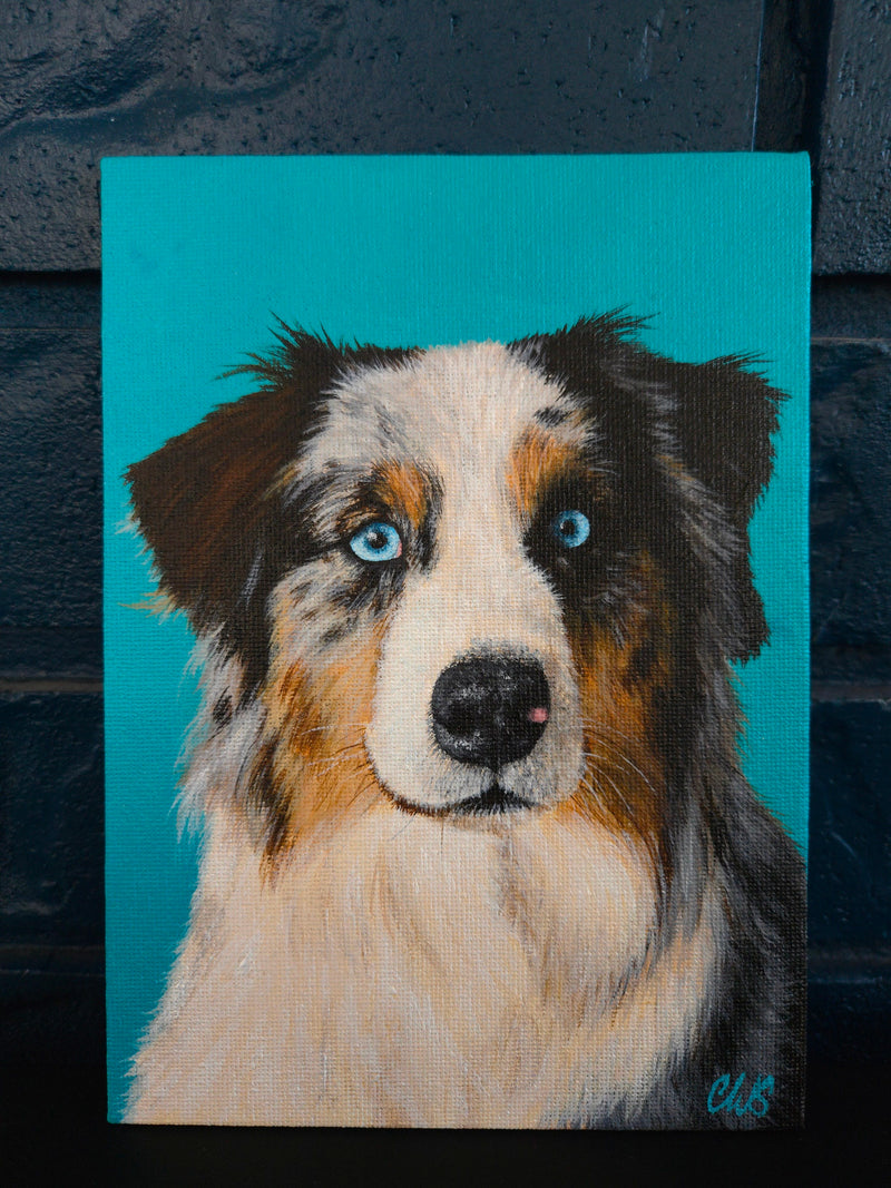 Painting of a dog with blue eyes on a teal background