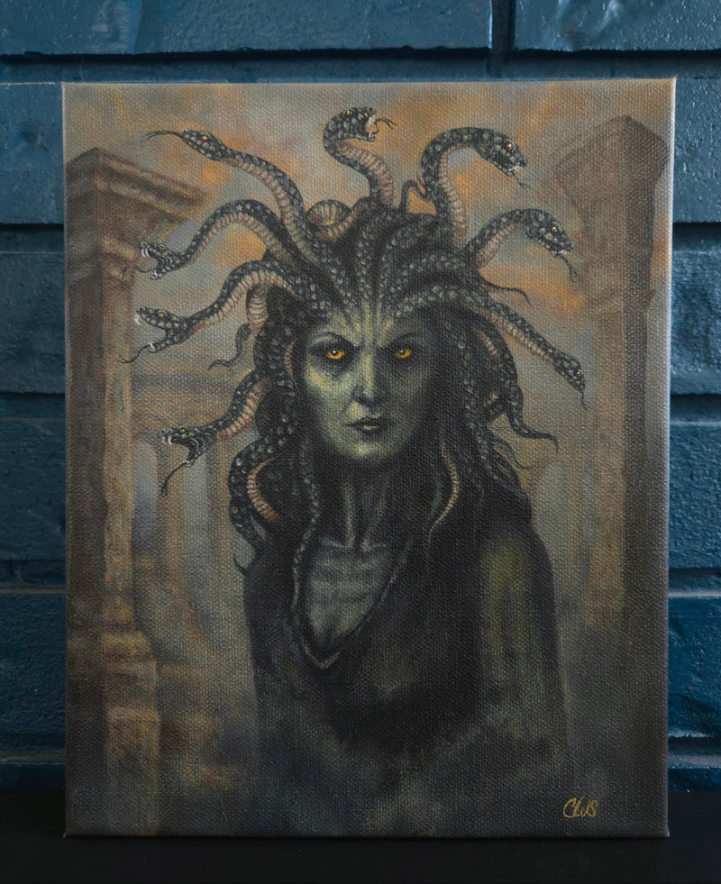 Painting of Medusa against a textured blue wall
