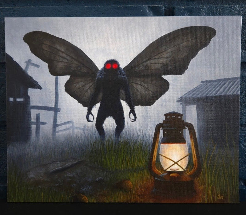 mothman with wings and red eyes near a lantern in a foggy, eerie setting.