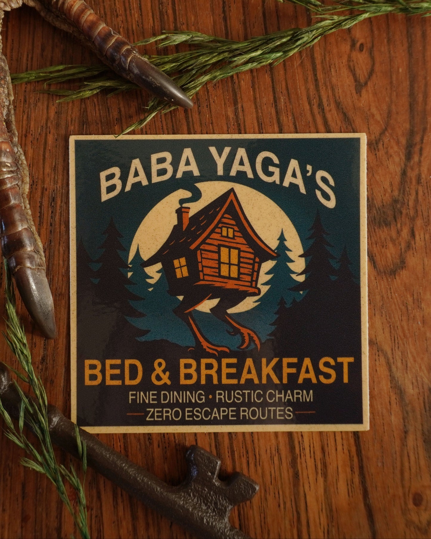 Baba Yaga's Bed & Breakfast logo on a wooden background .