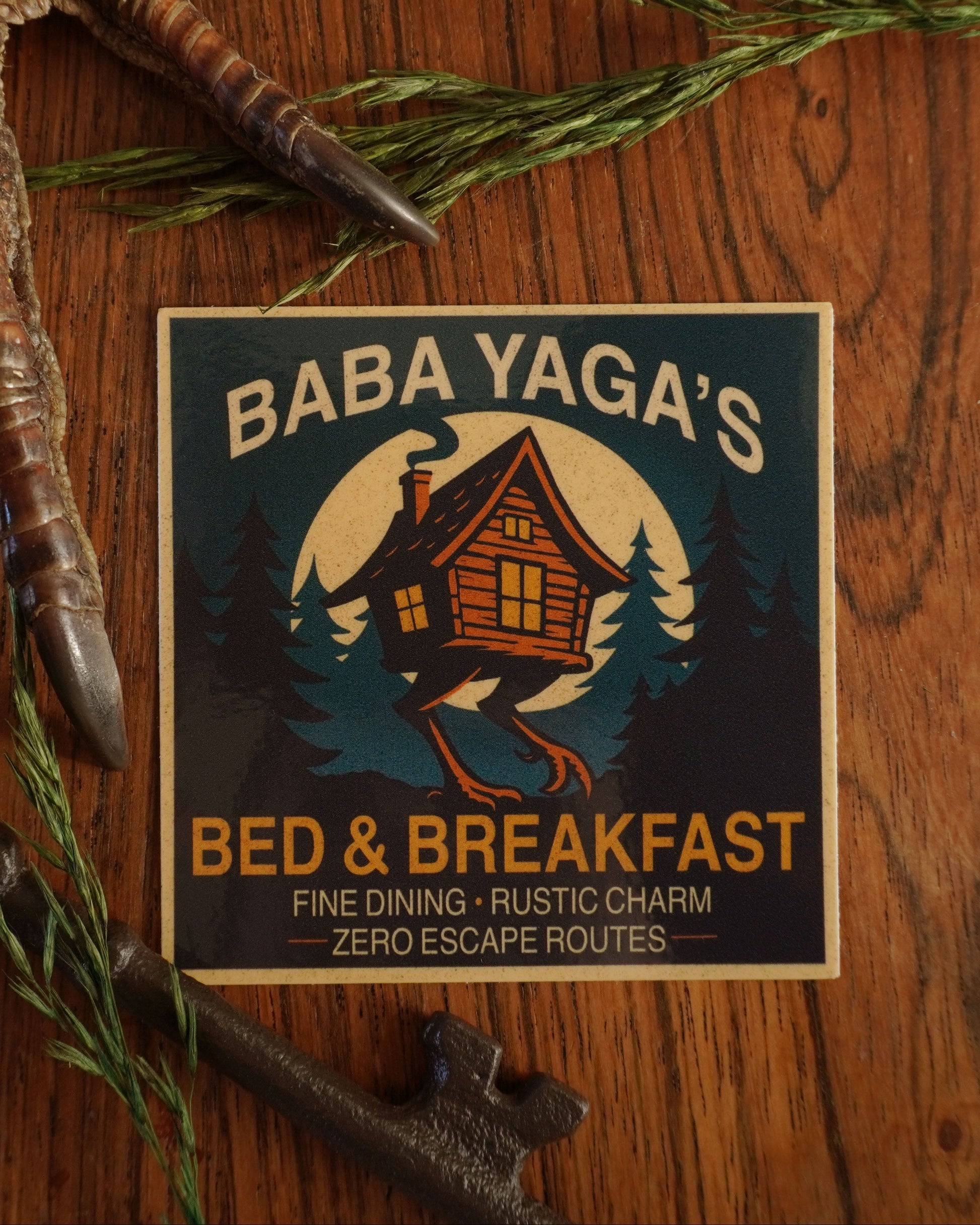 Baba Yaga's Bed & Breakfast logo on a wooden background .