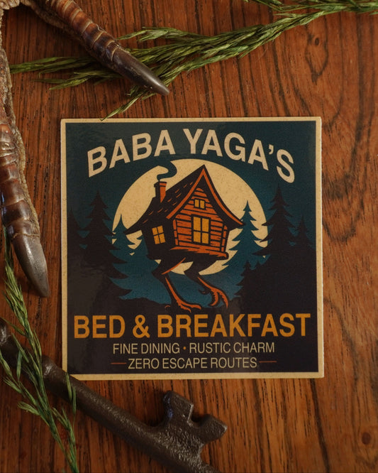 Baba Yaga's Bed & Breakfast logo on a wooden background .