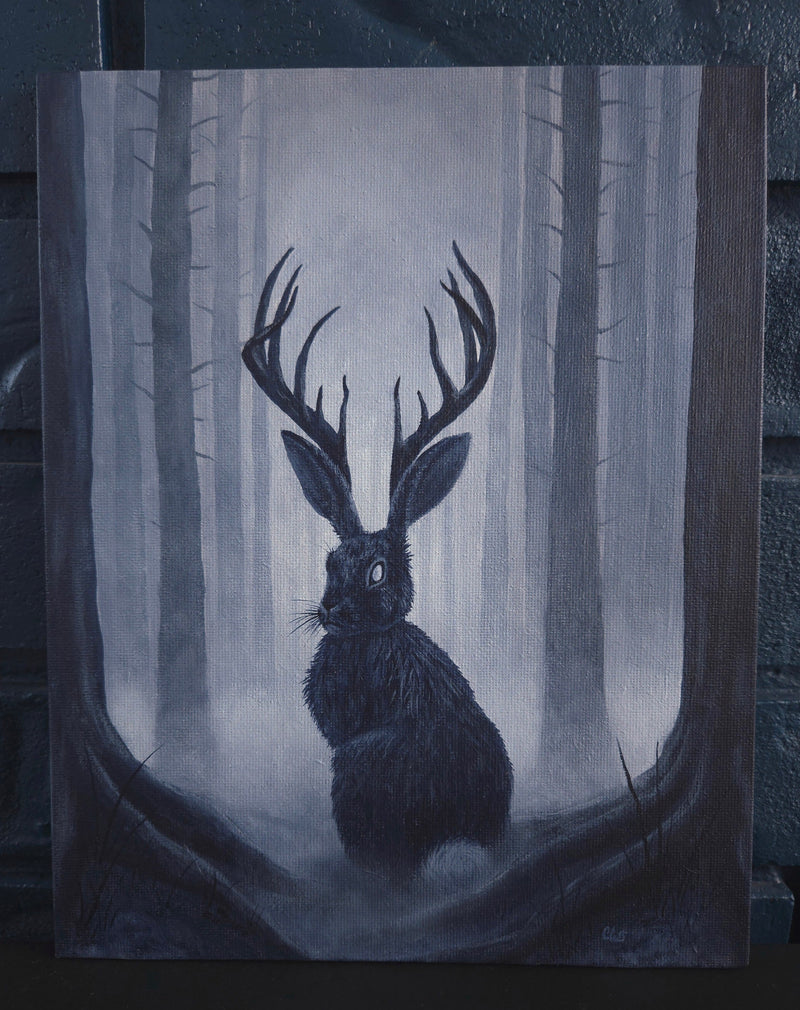 Dark forest scene with a jackalope creature resembling a hare with deer antlers, set against a misty background.